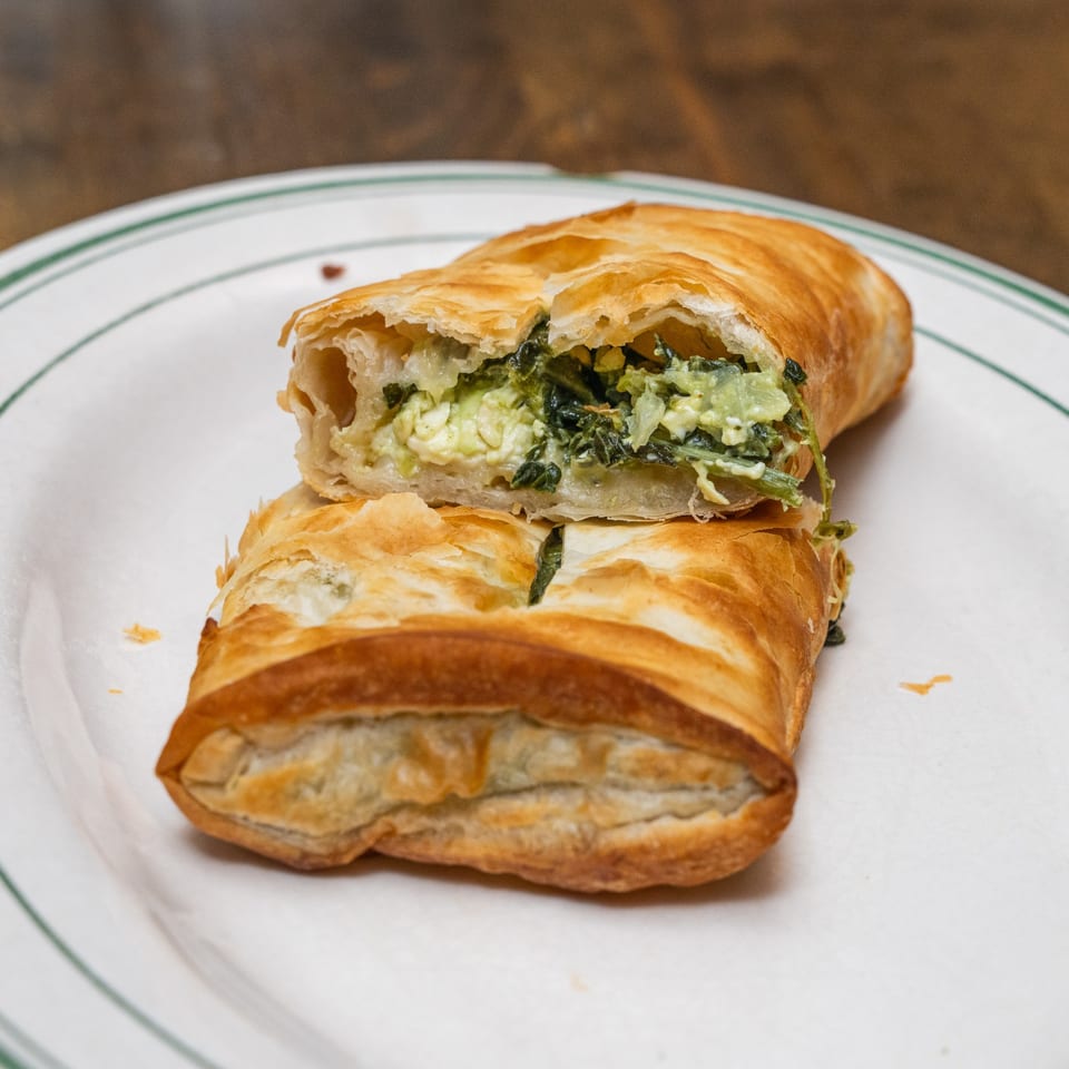 Flaky spanakopita with spinach and cheese filling.