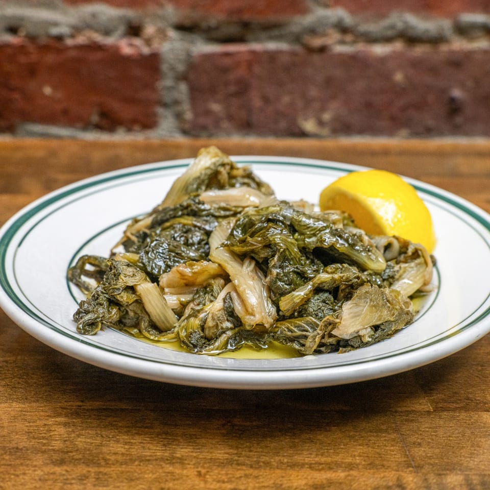 Horta greens served with lemon.