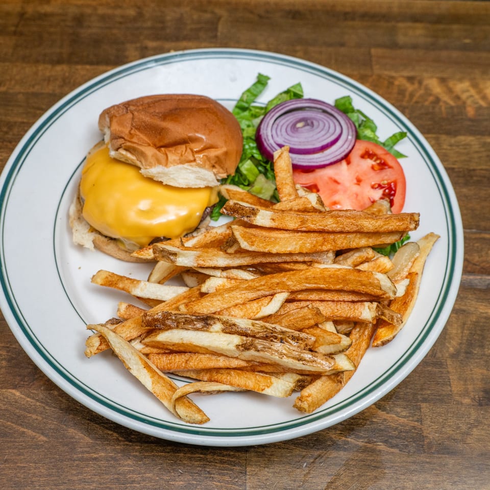Overhead view of cheeseburger and fries.
