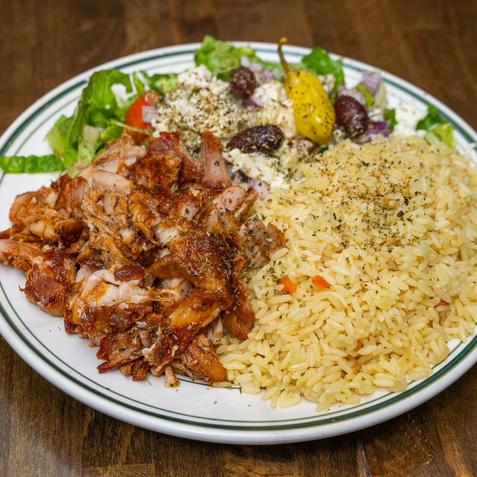 Chicken gyro lunch platter with rice and salad.